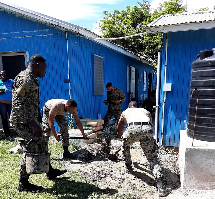 Jamaica Defense Force Officers lend their support to the Cockpit Basic School Bathroom Construction Project
